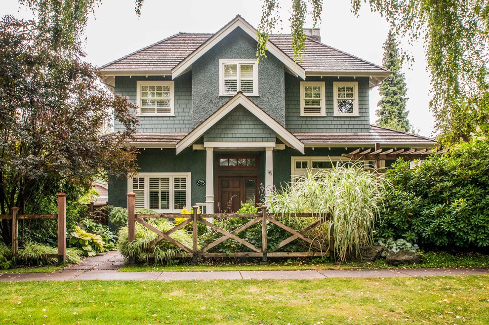 Inspiration for a timeless gray stucco exterior home remodel in Vancouver