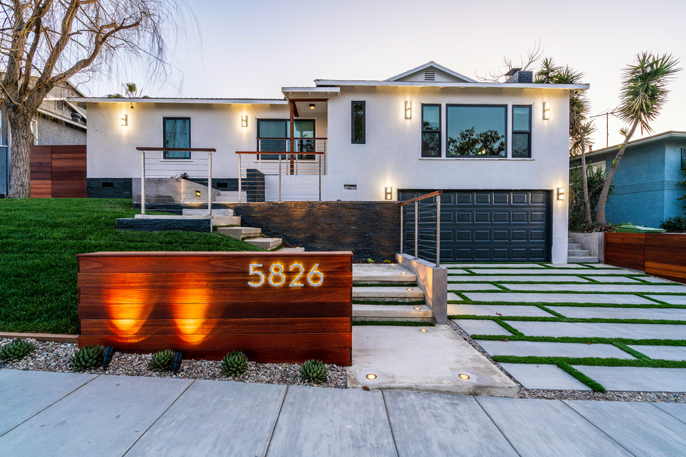 Large minimalist beige one-story house exterior photo in Los Angeles
