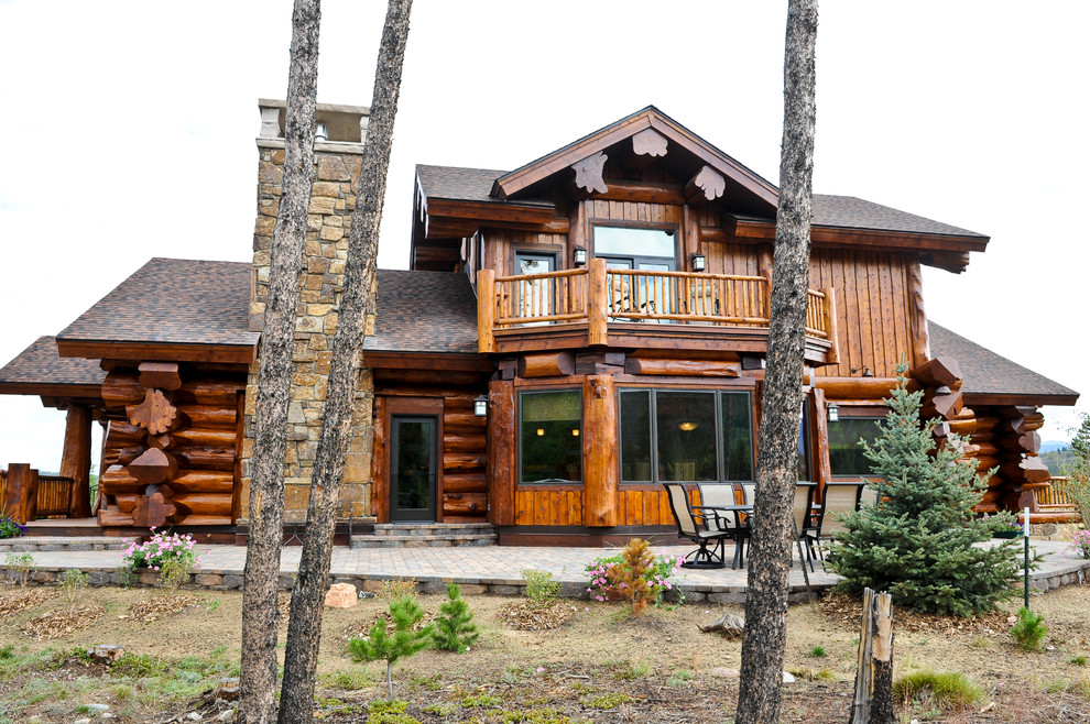 Example of a large mountain style brown split-level mixed siding exterior home design in Denver with a shingle roof