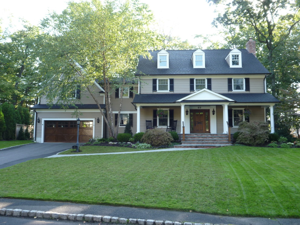 Inspiration for a mid-sized timeless brown two-story vinyl gable roof remodel in New York