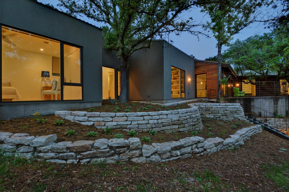 Example of an eclectic exterior home design in Austin