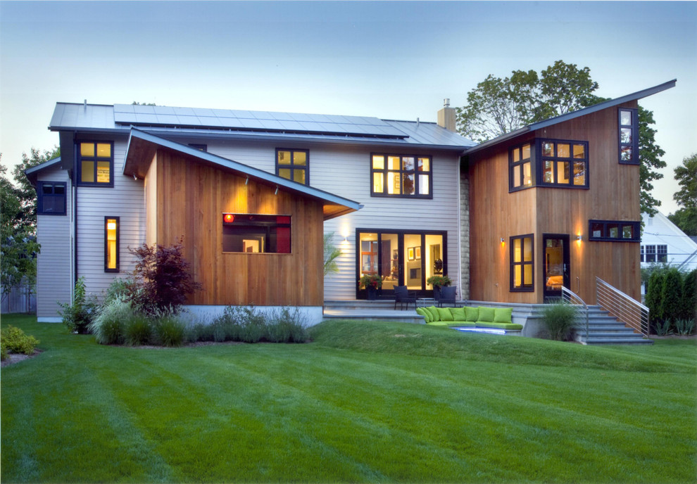 Inspiration for a mid-sized contemporary two-story mixed siding exterior home remodel in Other