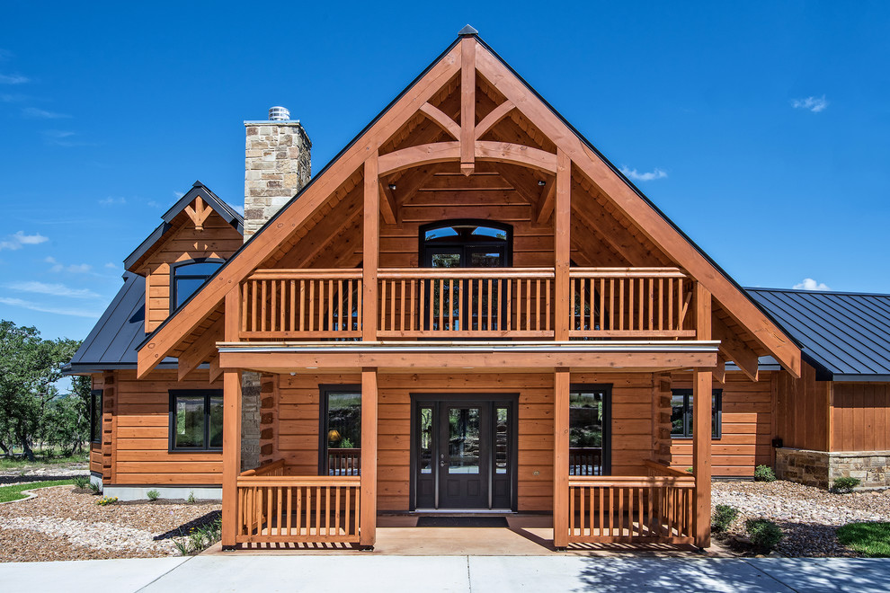 Example of a mountain style brown two-story wood exterior home design in Austin