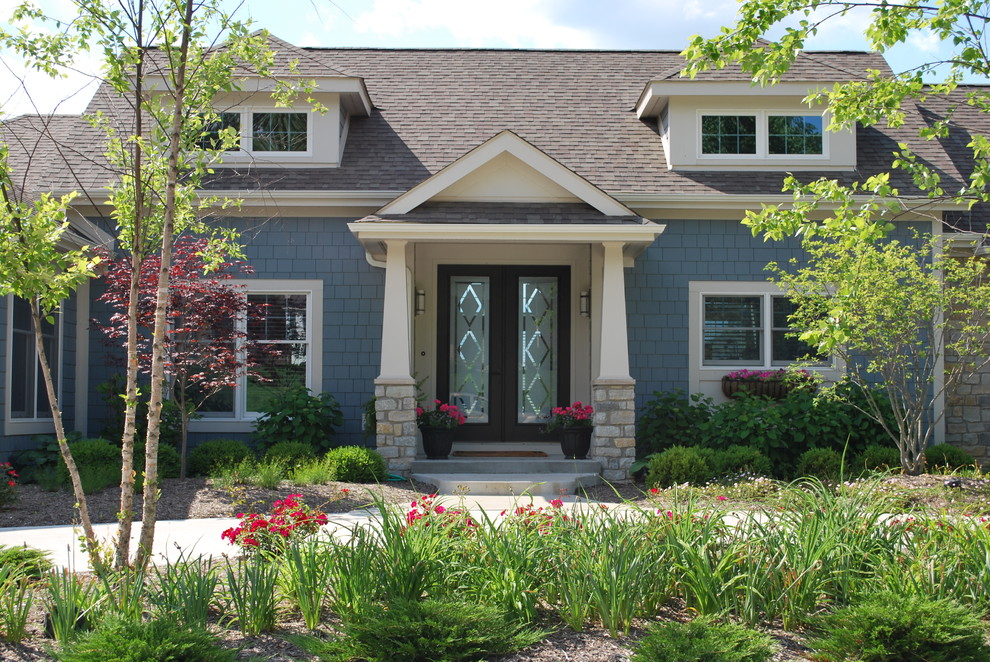 This is an example of a blue classic two floor house exterior in Indianapolis.