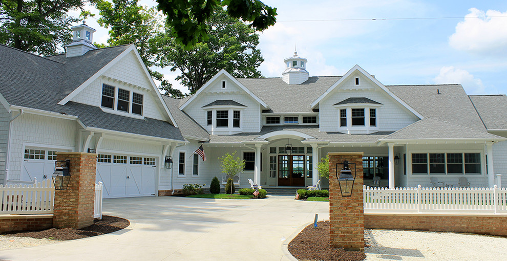 Example of a beach style white two-story concrete fiberboard exterior home design in Chicago