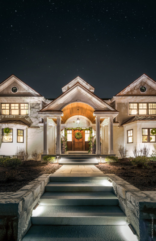 This is an example of an expansive and beige modern house exterior in Boston.