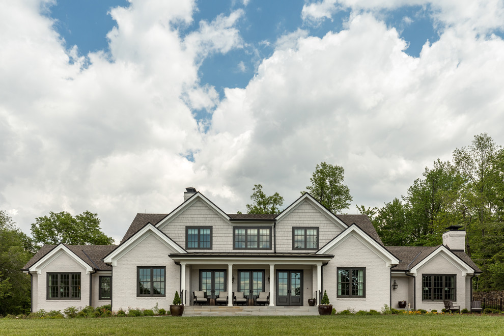 Traditional gray two-story mixed siding exterior home idea in Other with a shingle roof