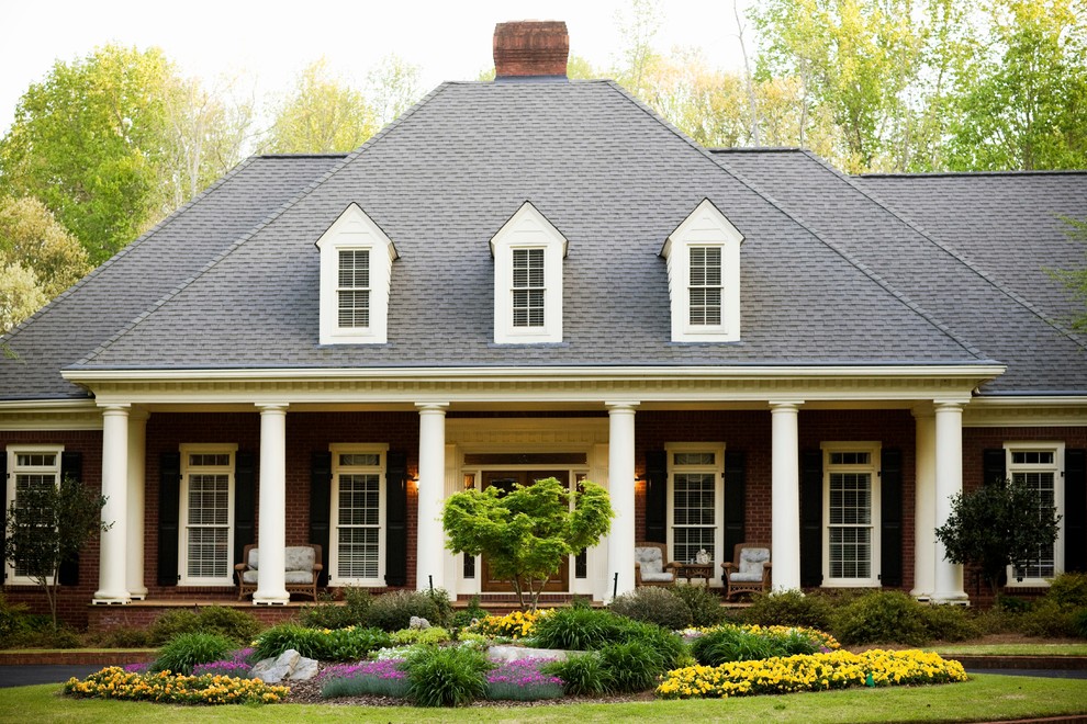 Inspiration for a large timeless two-story brick exterior home remodel in DC Metro with a hip roof