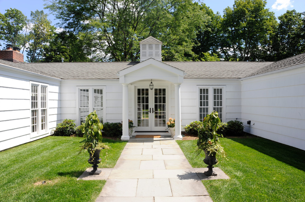 Traditional white one-story exterior home idea in New York