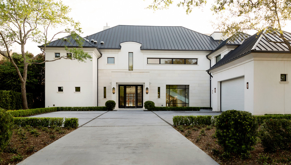 Large elegant white two-story mixed siding exterior home photo in Houston with a hip roof