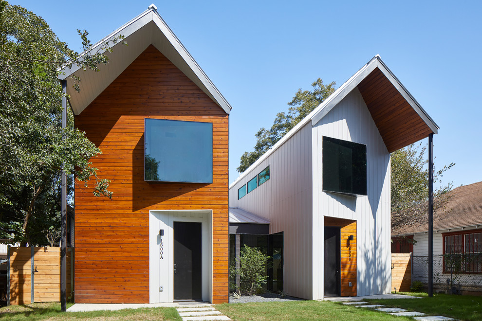 Inspiration for a white contemporary two floor semi-detached house in Austin with a pitched roof.