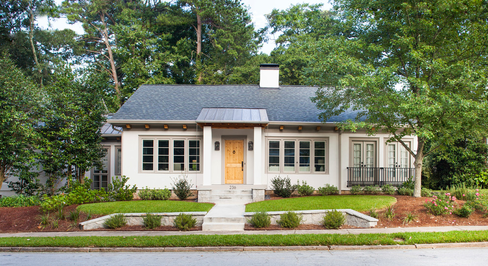 Mid-sized transitional white one-story stucco exterior home idea in Atlanta with a mixed material roof