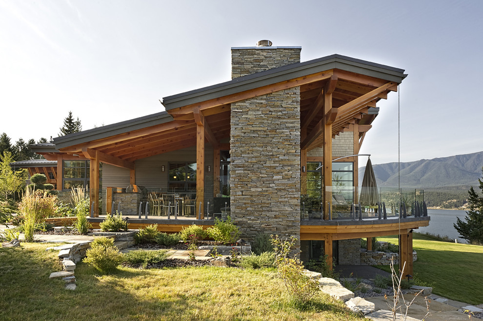 Design ideas for an expansive and gey rustic two floor detached house in Vancouver with mixed cladding, a lean-to roof and a metal roof.