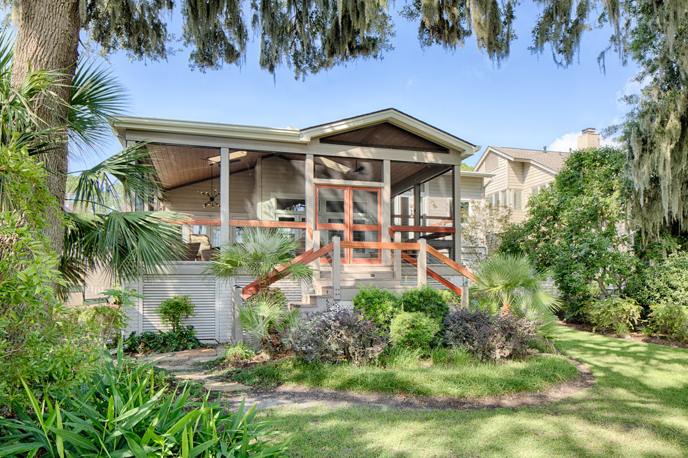 Tropical gray one-story exterior home idea in Other