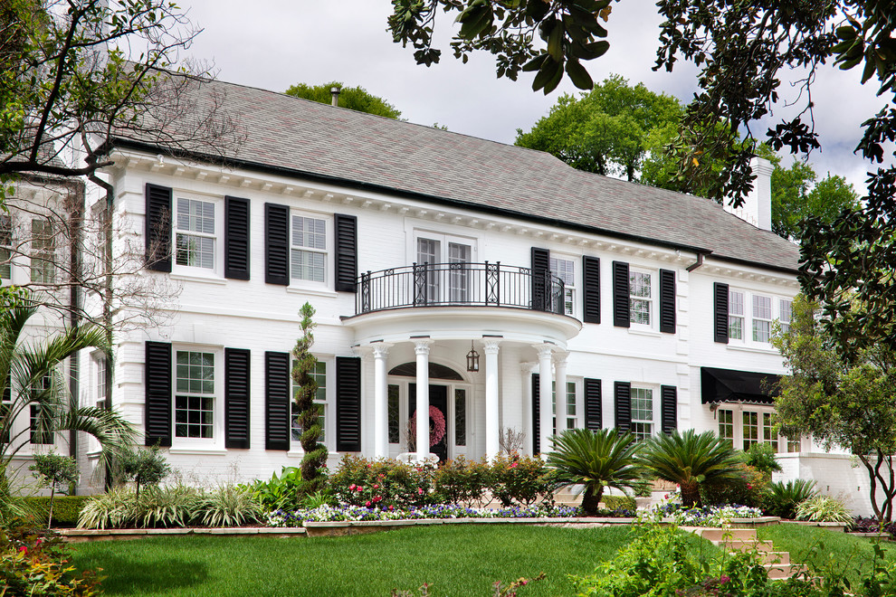 Elegant white two-story exterior home photo in Austin