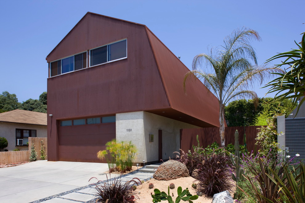 This is an example of a red modern two floor detached house in Los Angeles with metal cladding, a pitched roof and a metal roof.
