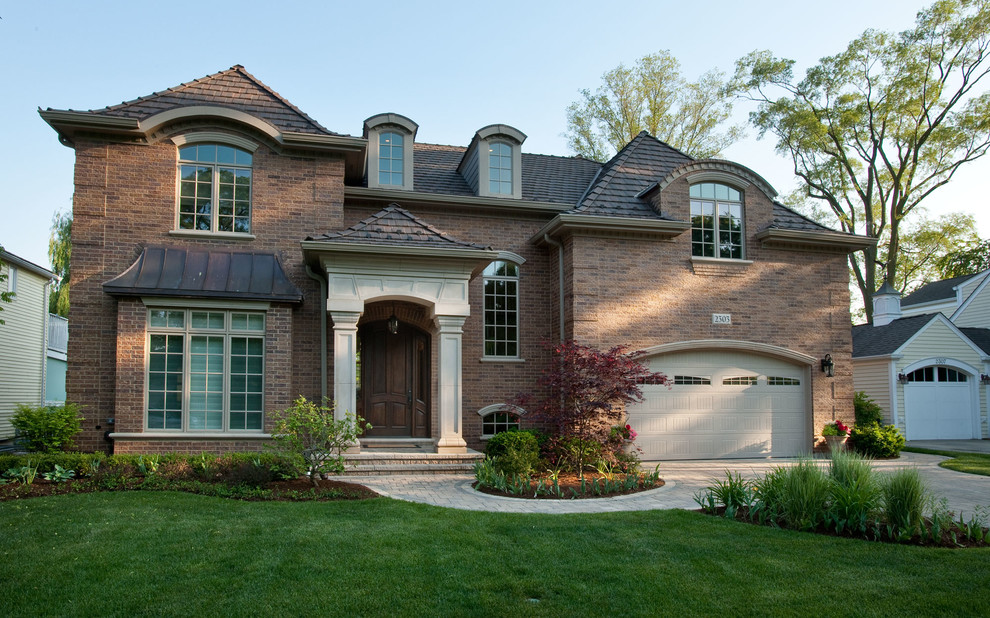 Inspiration for a medium sized traditional two floor brick house exterior in Chicago.