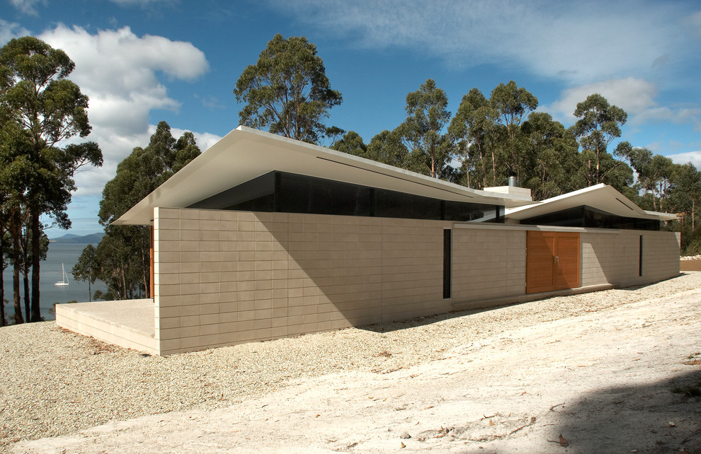 Design ideas for a medium sized and gey contemporary bungalow brick house exterior in Hobart.