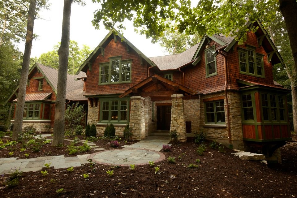 Inspiration for a large craftsman brown two-story wood gable roof remodel in Chicago