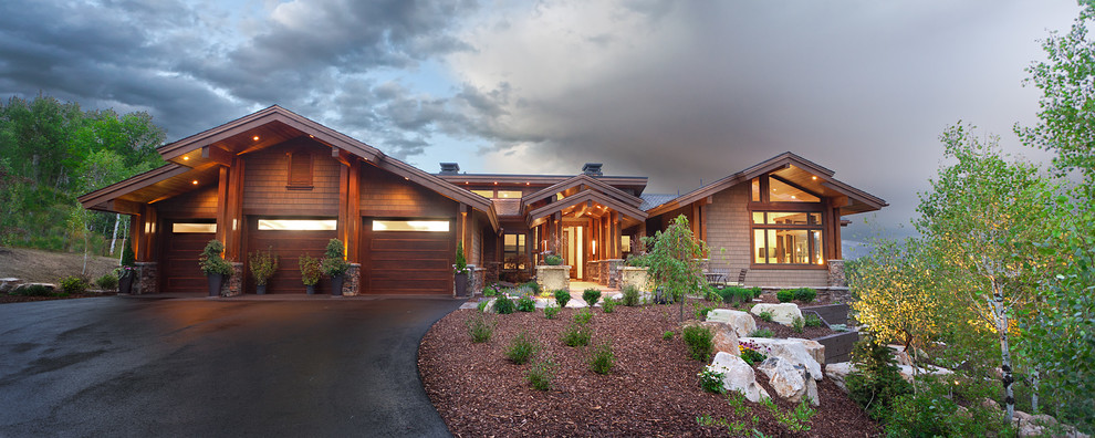 Huge transitional brown two-story wood exterior home photo in Salt Lake City with a metal roof