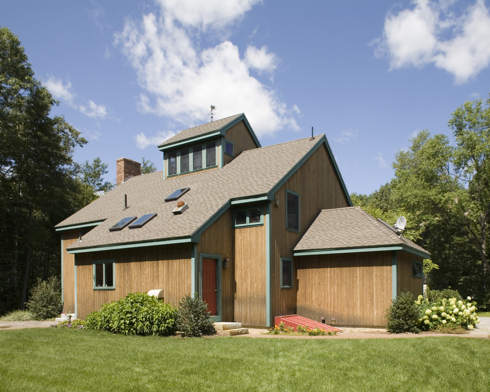 This is an example of a medium sized contemporary house exterior in Boston with wood cladding.