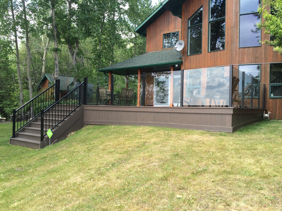 Mid-sized mountain style brown two-story wood gable roof photo in Calgary