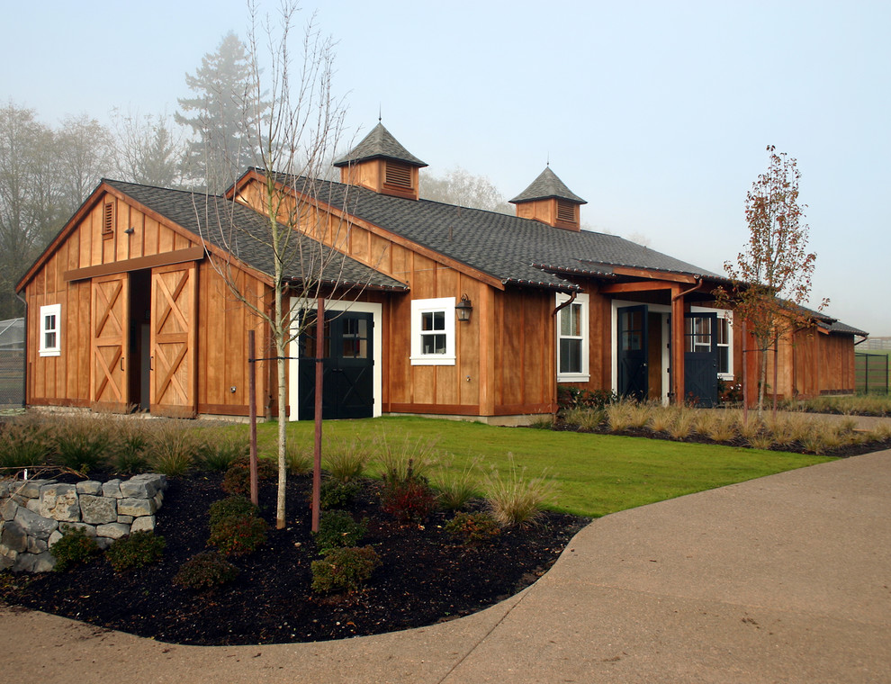 Mid-sized rustic brown one-story wood gable roof idea in Portland