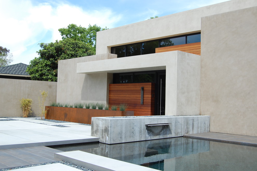 Design ideas for a contemporary house exterior in Sacramento with wood cladding.