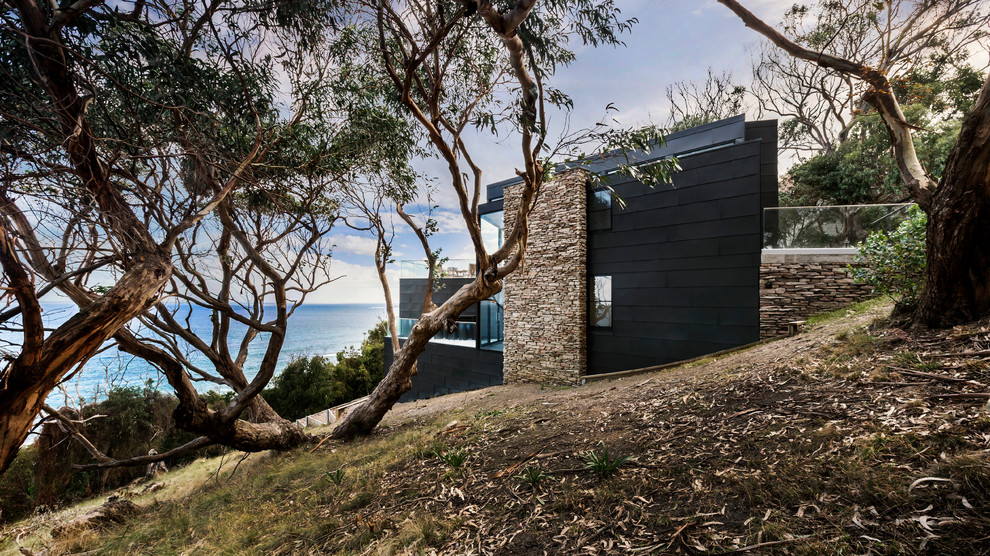 Photo of a medium sized contemporary house exterior in Melbourne with three floors.