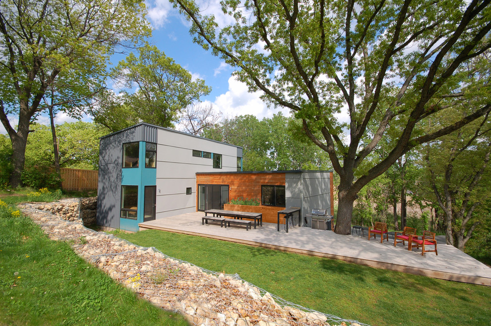 Blue contemporary two floor house exterior in Minneapolis with mixed cladding.