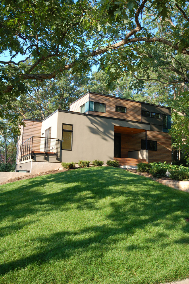 Example of a minimalist beige two-story mixed siding exterior home design in Minneapolis