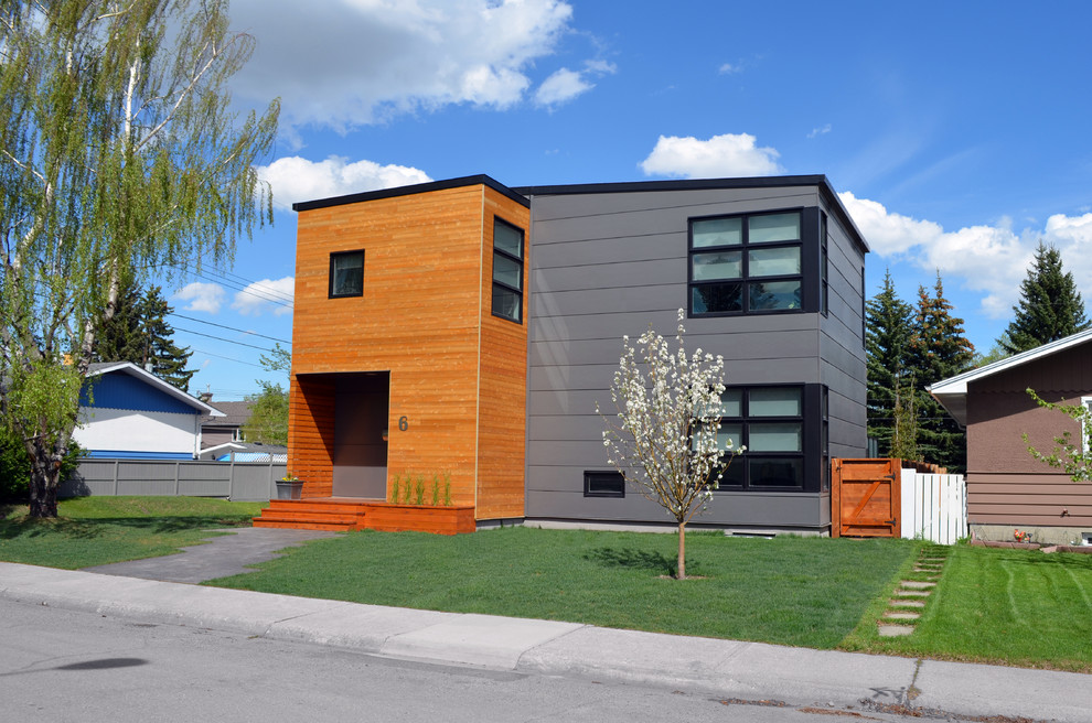 Minimalist gray two-story mixed siding exterior home photo in Calgary