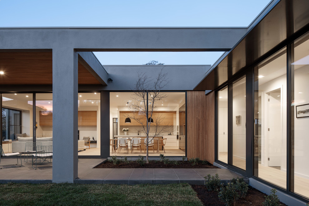 Design ideas for a contemporary house exterior in Canberra - Queanbeyan.