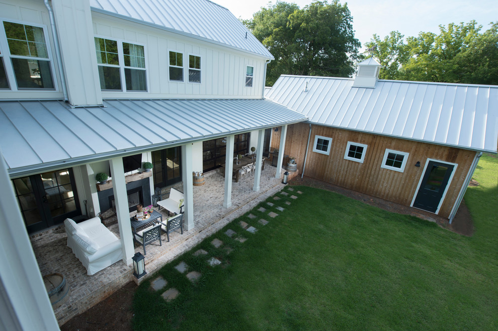 Example of a large farmhouse white two-story concrete fiberboard exterior home design in Atlanta