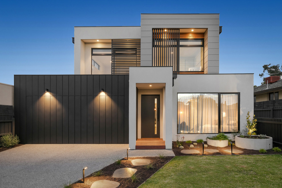 Diseño de fachada de casa multicolor contemporánea de dos plantas con tejado plano