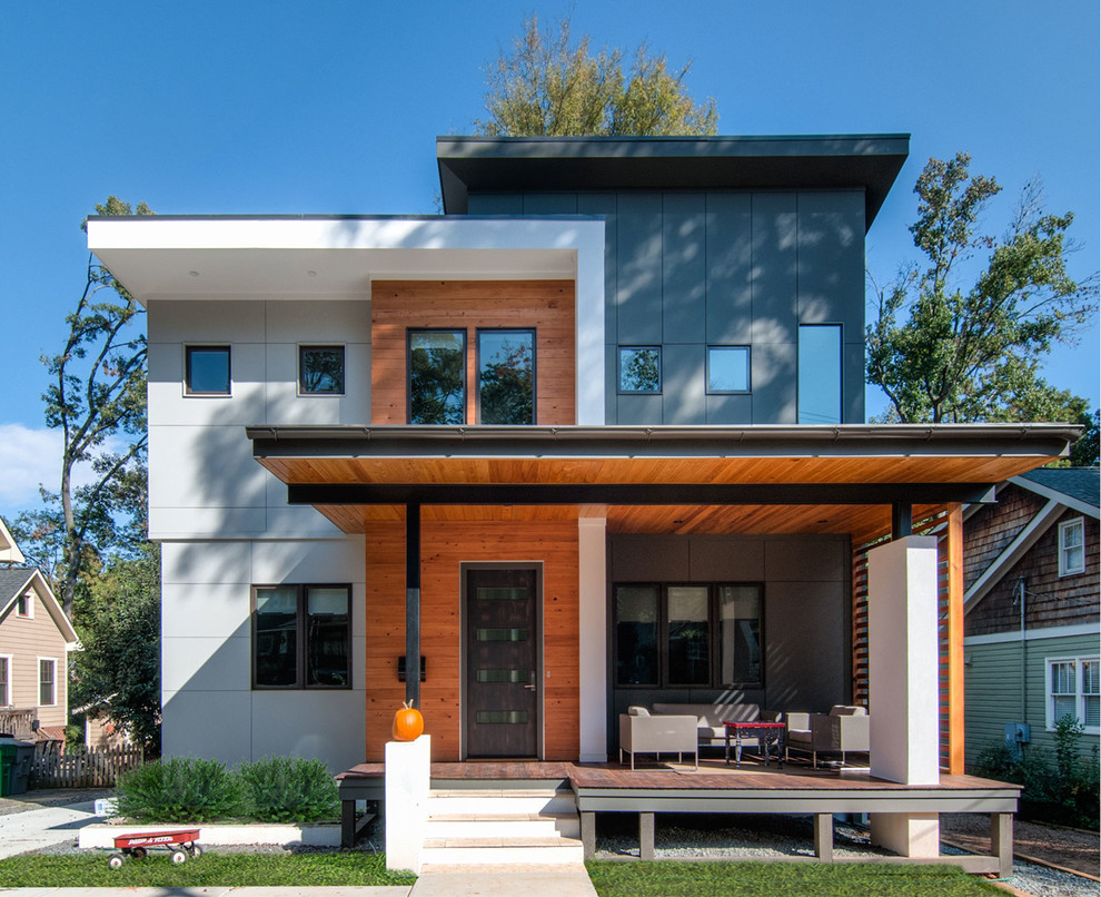 Стильный дизайн: двухэтажный дом в современном стиле с комбинированной облицовкой и плоской крышей - последний тренд