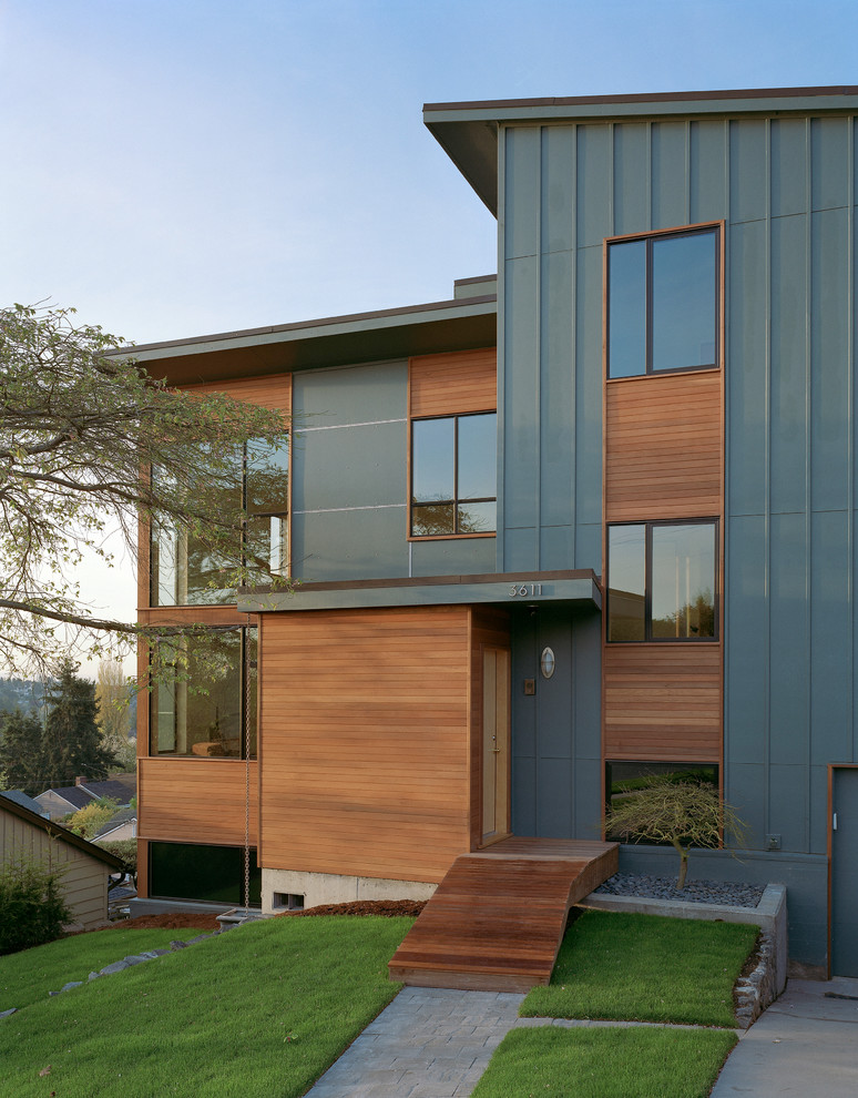 Contemporary wood exterior home idea in Seattle