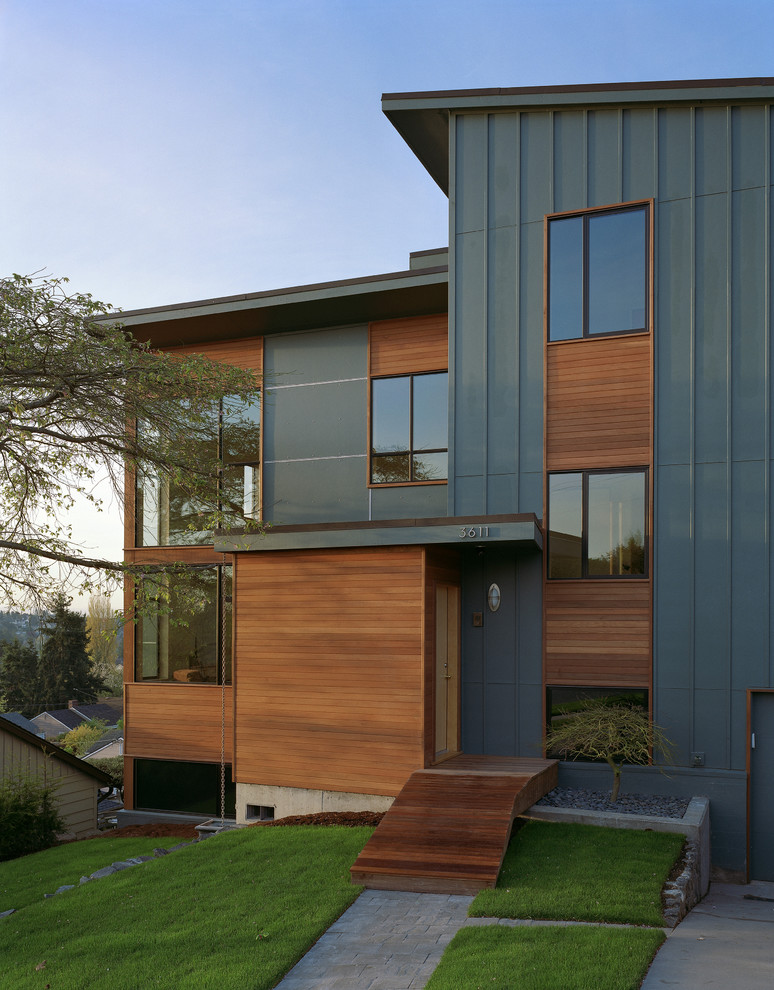 Inspiration for a contemporary wood exterior home remodel in Seattle