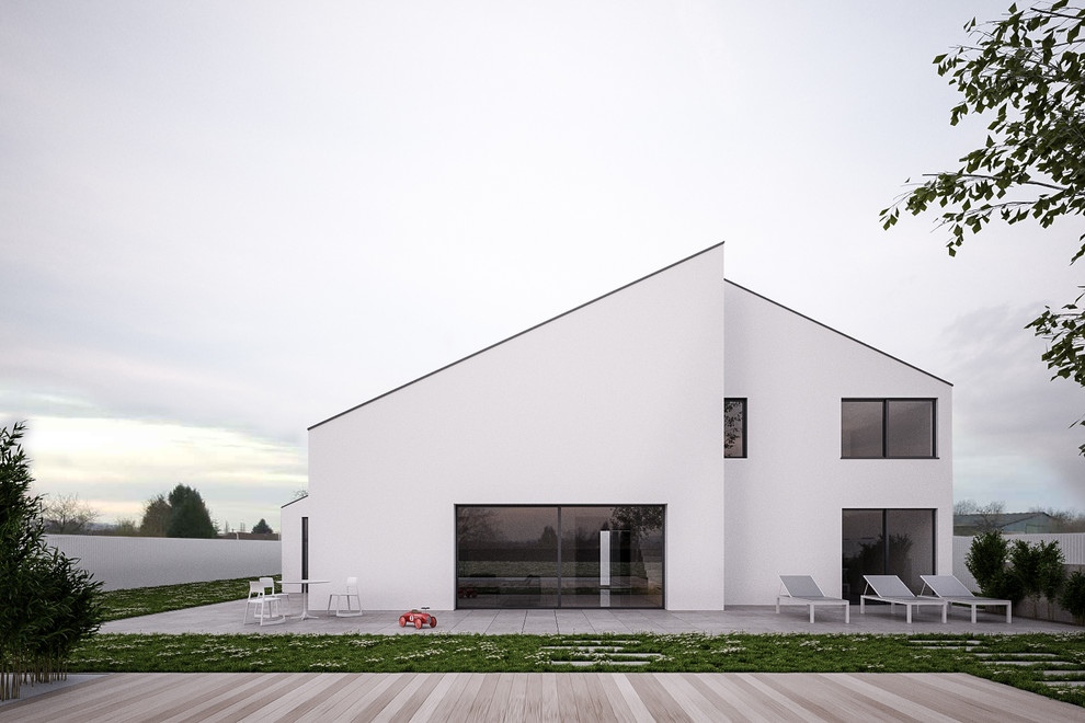 Пример оригинального дизайна: большой, двухэтажный, белый дом в современном стиле