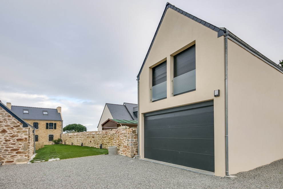 Photo of an expansive and white rural detached house in Brest with three floors, stone cladding, a pitched roof and a mixed material roof.