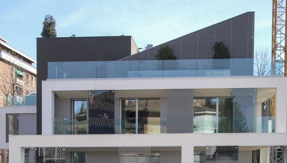 Photo of a contemporary house exterior in Milan with mixed cladding.