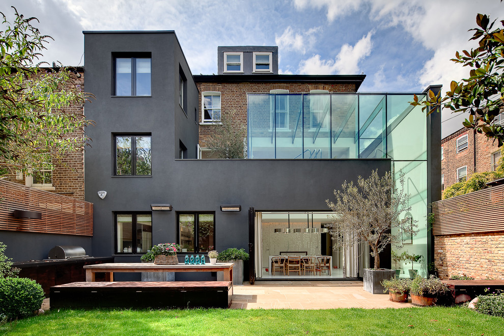 Idées déco pour une façade de maison noire contemporaine en verre à deux étages et plus.