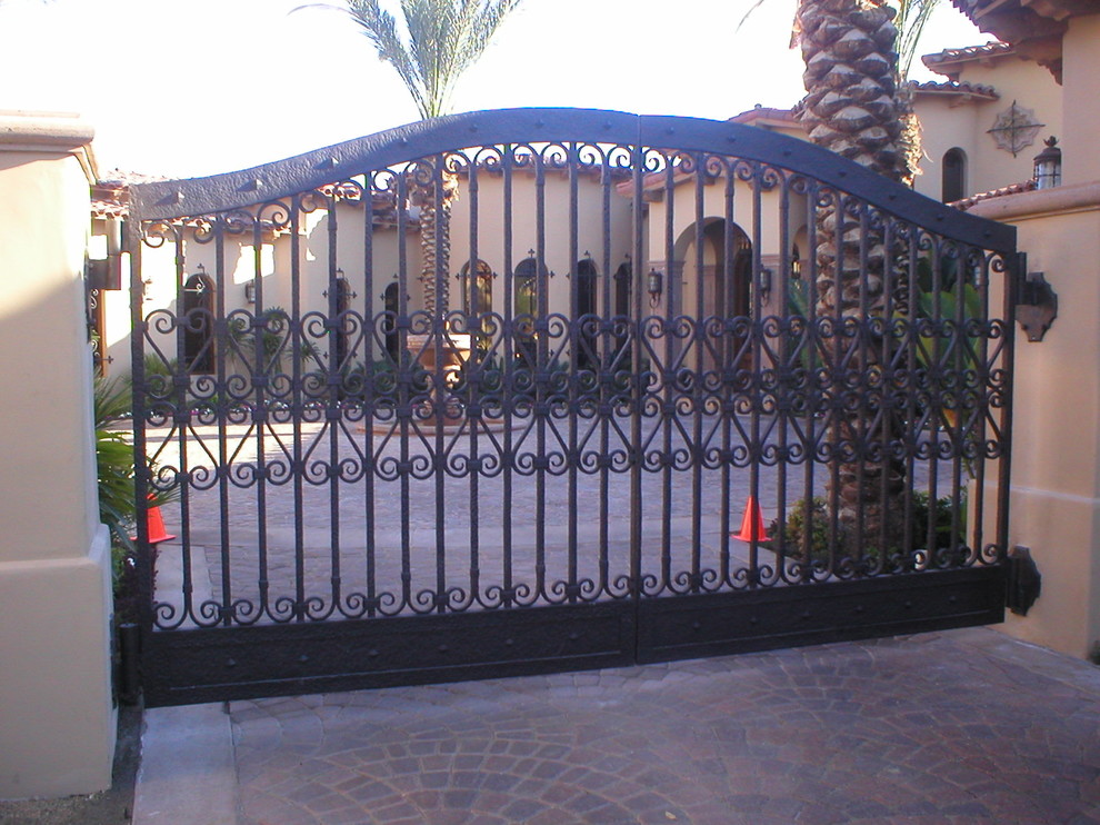 This is an example of a beige mediterranean render house exterior in Santa Barbara.