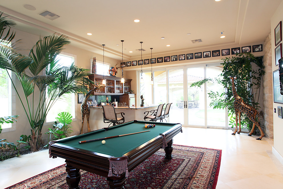 This is an example of a mediterranean games room in Las Vegas with beige walls.