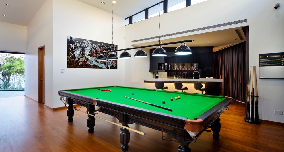 Photo of a world-inspired games room in Singapore with white walls.