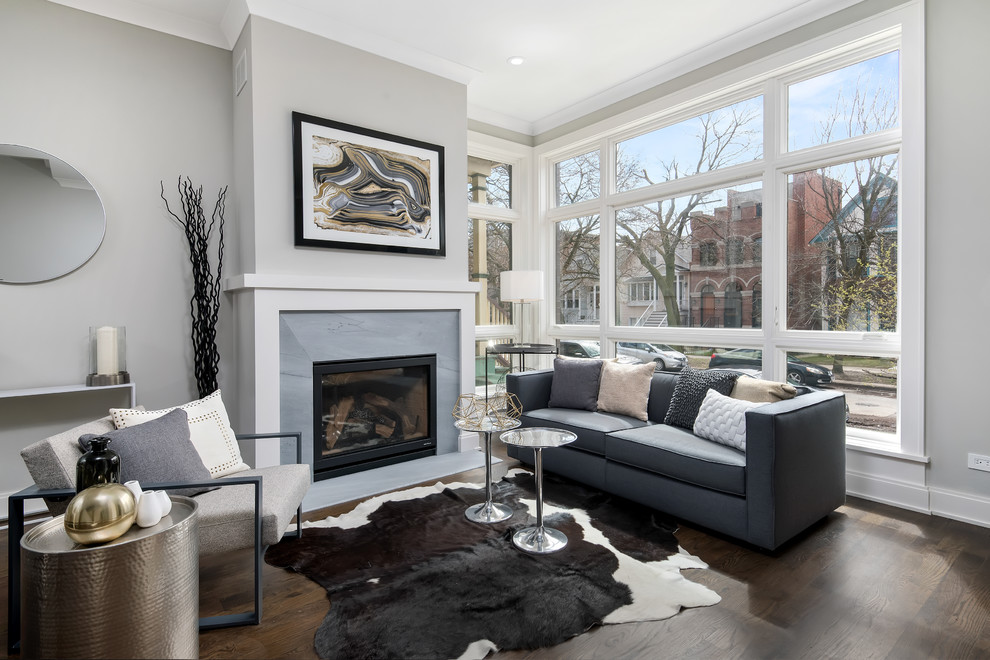 Inspiration for a classic open plan games room in Chicago with grey walls, dark hardwood flooring, a standard fireplace and a stone fireplace surround.