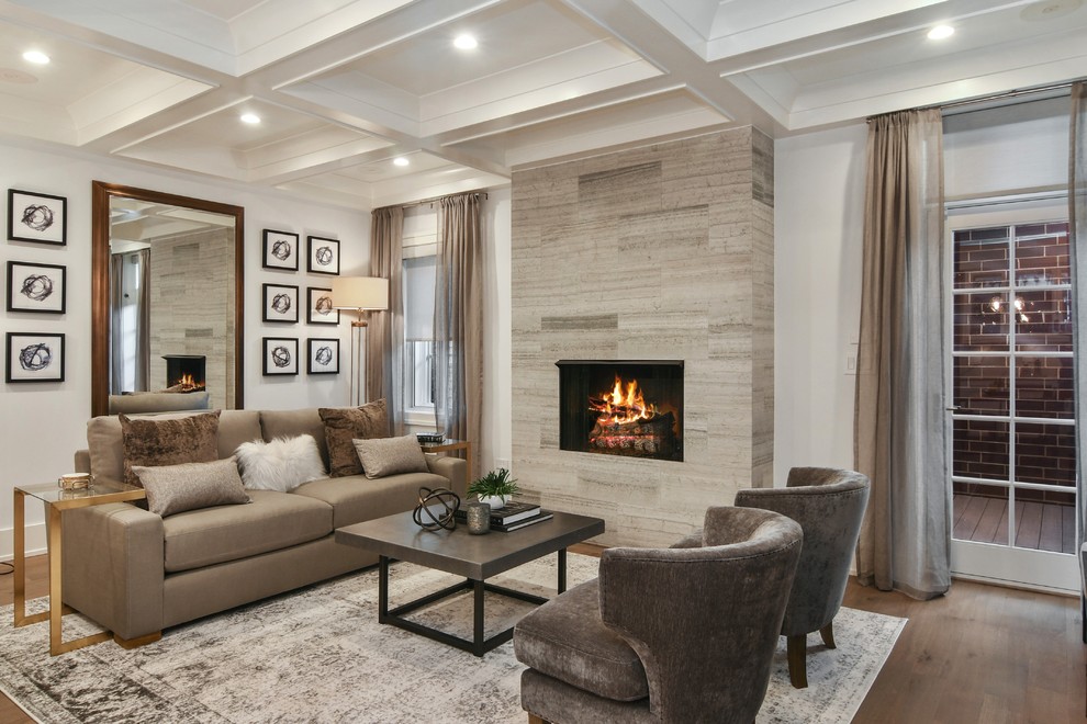 Inspiration for a traditional games room in Chicago with white walls, dark hardwood flooring, a standard fireplace, a tiled fireplace surround and brown floors.