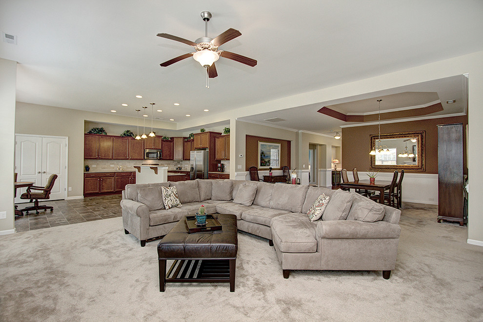 Inspiration for a classic open plan games room in Charlotte with carpet and a standard fireplace.