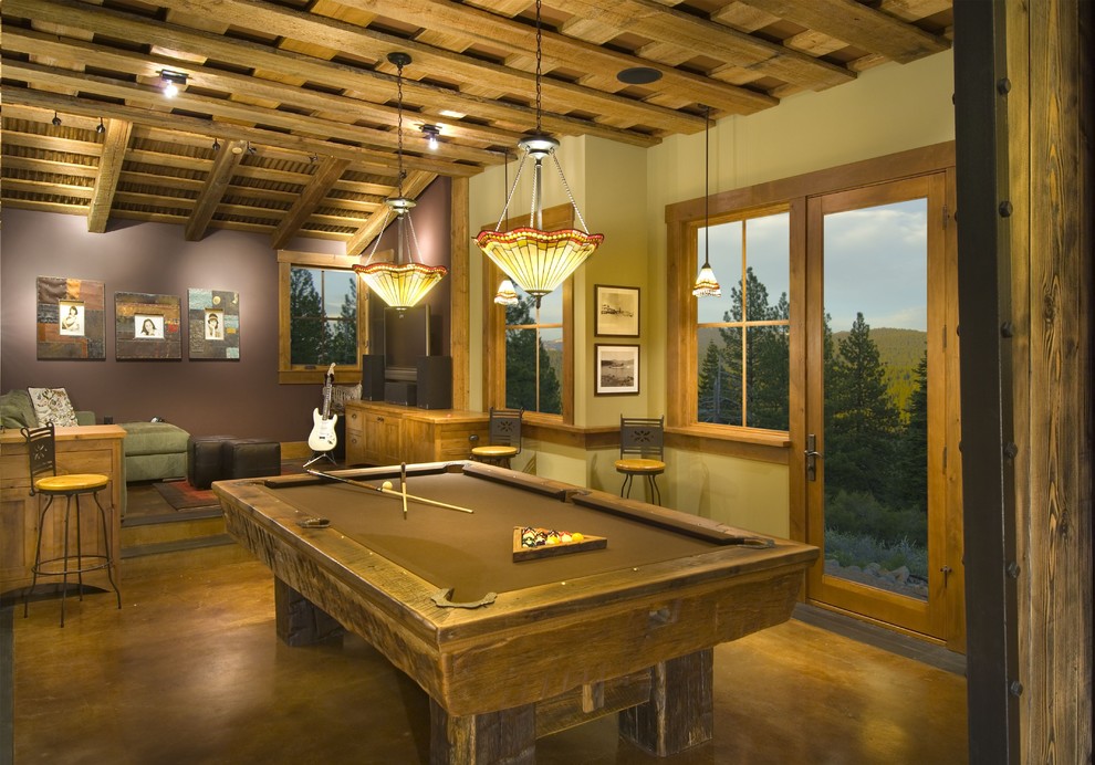 Inspiration for a rustic games room in Sacramento with concrete flooring.