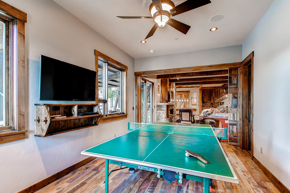 Design ideas for a classic open plan games room in Denver with a game room, beige walls and dark hardwood flooring.